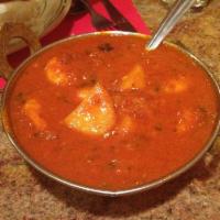 75. Shrimp Vindaloo · Cooked with fiery red chilies, spices, potato and touch of vinegar.