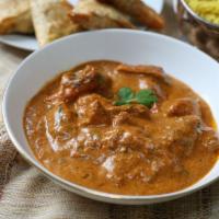54. Lamb Curry · Lamb cooked in an authentic onion and tomato based curry sauce.