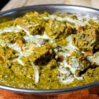 56. Saagwala · Meat cooked with fresh spinach and spices.