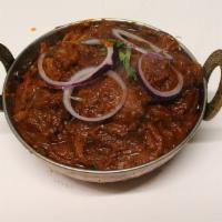 60. Bhuna · Sauteed with fresh ginger, garlic, onion, tomatoes and spices in a thick curry sauce.