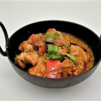 64. Lamb Korai · Lamb cooked in an authentic onion and tomato based curry sauce and green peppers.