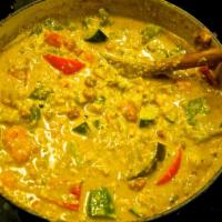 85. Navrattan Korma · Assorted vegetables cooked with fruit cocktails in a rich almond creamy curry sauce.
