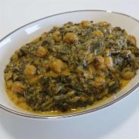 86. Chana Saagwala · Your choice of potatoes or chickpeas cooked with fresh spinach and spices.
