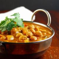 90. Chana Masala · Chickpeas cooked in a chef special masala curry sauce.