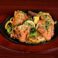 31. Chicken Tandoori · Chicken with bone marinated in yogurt and house special spices.