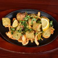 34. Chicken Sheekh Kabab · Minced chicken with onion and kabab masala in skewers.