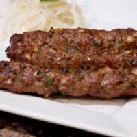 38. Lamb Sheekh Kabab · Minced lamb with onion and kabab spices in skewers.