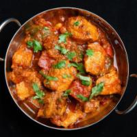 48. Chicken Jalfrezi Curry · Chicken cooked with fresh assorted vegetables in tomato based curry sauce.