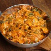 50. Chicken Achaari Curry · Cooked in onion based curry with ginger, garlic and Indian pickles.