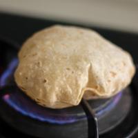 105. Chapati · Large whole wheat bread baked on a flat skillet.