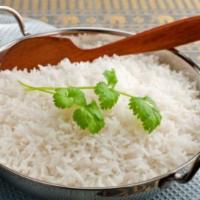 112. Basmati Rice · Saffron rice garnished with green peas.