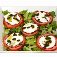 Caprese Salad · Fresh mozzarella, tomato, mix greens, and basil oil. Vegetarian.