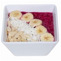 Dragon Fruit Bowl · Blended dragon fruit, topped with sliced almonds, coconut flakes, and banana.