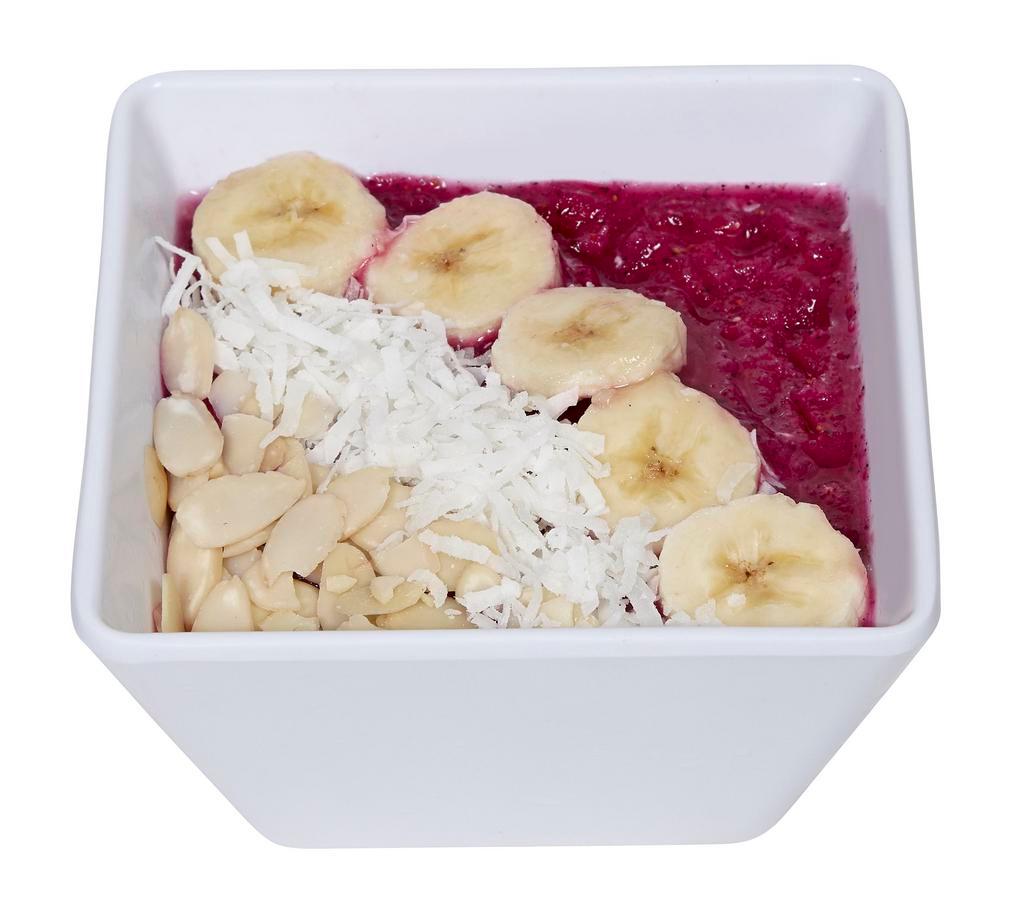 Dragon Fruit Bowl · Blended dragon fruit, topped with sliced almonds, coconut flakes, and banana.