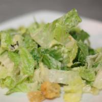 Caesar Salad · Romaine, garlic croutons and shaved Parmigiano cheese in a creamy Caesar dressing.