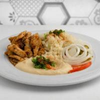 Chicken Shawarma Plate · Plates include rice or fries, soup or salad, and bread. Chicken shawarma with hummus, onions...