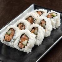 Spicy Salmon Roll · Salmon mixed with spicy mayo combined with cucumber, rolled in seaweed and rice.
