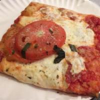 Grandma Pizza · 9 slices. On a thin crust, pan baked is a fresh plum tomato sauce, imported pecorino Romano,...