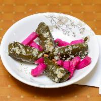 Grape Leaves · Homemade and stuffed with rice and vegetables.