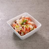 Shrimp Ceviche · Small pieces of fresh shrimp cooked in lime juice with diced tomato, onions and cilantro, to...