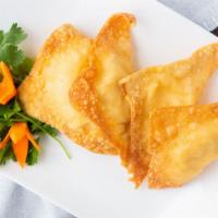 9. Crab Rangoon · 4 pieces. Cream cheese and crab meat in a crispy flour wrapper.