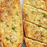 Garlic Bread · House made Garlic Butter on Italian Wedge