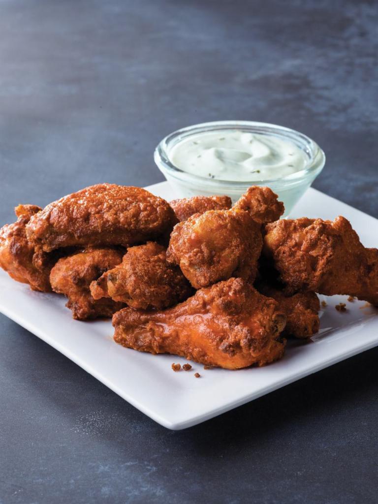 15 Piece Chicken Wings · 15 classic chicken wings served hot or tangy BBQ style with your choice of dipping sauce.