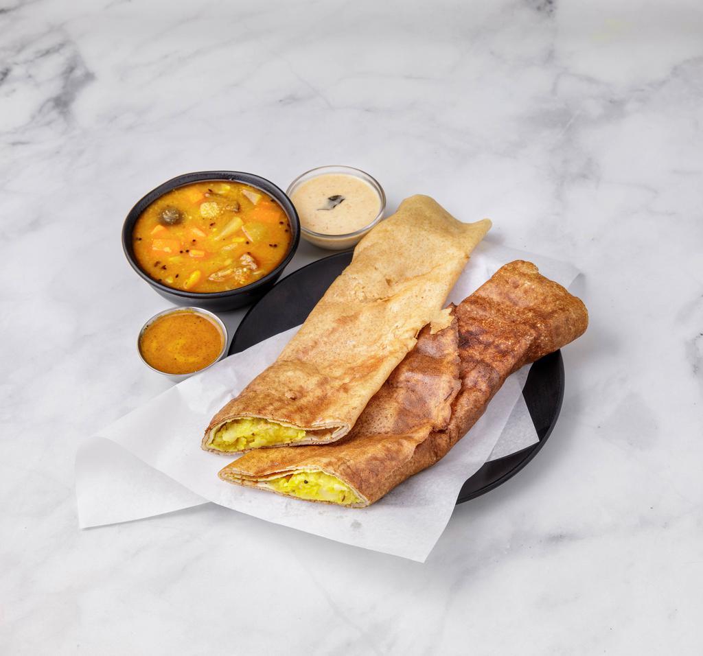 Masala Dosa  · Thin crepe made of rice and lentils and stuffed with potatoes and onions.