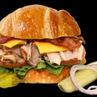 #67. Turkey Club with Bacon Croissant · Turkey club with bacon in a croissant sandwich.
