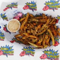 Garlic Fries · Hand cut fries smothered with fresh garlic and topped with parsley. Served with our signatur...