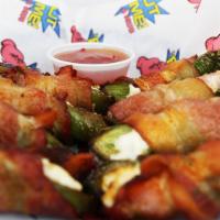 Stuffed Jalapeños · Fresh jalapenos, stuffed with cream cheese and wrapped in bacon.