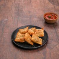 Toasted Ravioli · Served with red sauce.