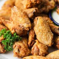 Chicken Wings · Golden fried wings served with a spice mixed sauce.