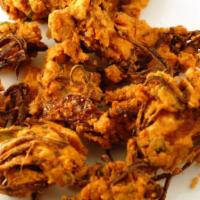 Onion Pakoda with Chutney · Sliced onions mixed with few spices and dipped in chick pea batter and fried.