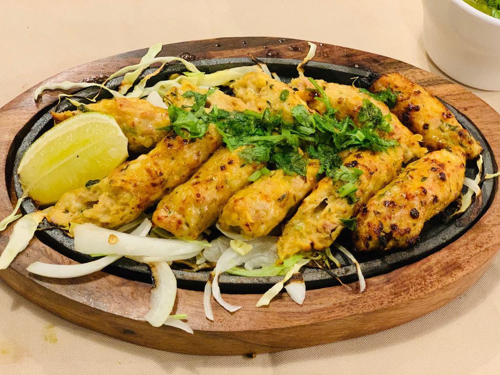 Chicken Cheese Kabab · Minced chicken stuffed with cheese and fresh herbs, grilled tender and juicy.