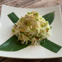 Sumi Salad · Shredded cabbage with almonds, sesame seeds, ramen, green onion, and Sumi dressing.