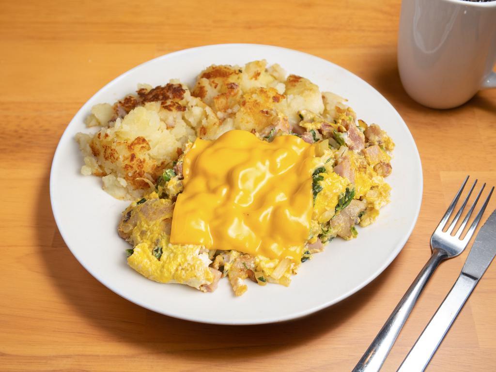 Western Scramble · 2 eggs scrambled with smoked chicken apple sausage, yellow onion, green bell pepper, tomato and cheddar cheese (served with house potatoes and choice of toast: wheat, white, rye bread, sourdough, or English muffin.