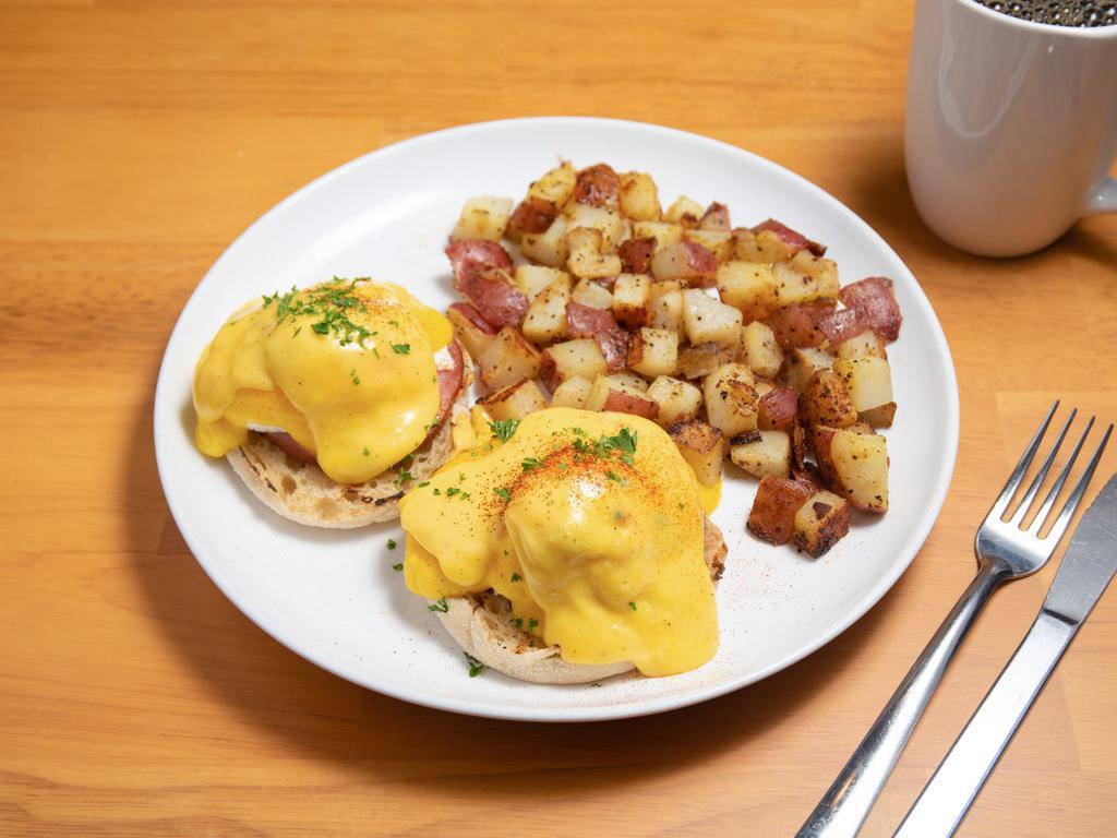 Eggs Benedict · Poached eggs, Canadian bacon and house made hollandaise sauce on a toasted English muffin. Served with house potatoes.