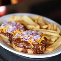 Cowboy Burger · For chili lovers this is the ultimate open faced chili burger. Topped with onion and cheddar...