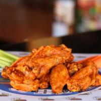Hot Wings · Fried wings covered with our hot sauce, served with ranch dressing, celery and carrot sticks.