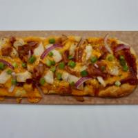 BBQ Chicken Flatbread Pizza · BBQ Sauce, Cheddar Cheese, Chicken Breast, Bacon, Sliced Red Onion, Finished with Green Onions