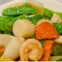 3 Ingredients Special Dinner · Jumbo prawns, scallops and calamari with vegetables stir fried in a garlic wine sauce.