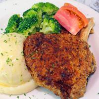 They Say Pork Chop  · A 10 oz bone in chop with the option of fried or grilled. Served with the choice of 2 solos.