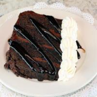 Decadent Chocolate Cake · Four gigantic layers fo chocolate cake filled and covered with a chocolate butter icing. Fin...