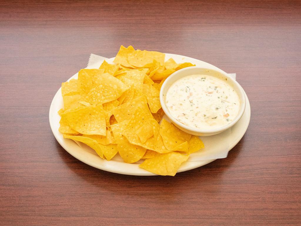 Dundee Dip · A spicy blend of pepper jack cheese, spinach, jalapenos, onions and tomatoes. Served with fresh tortilla chips.