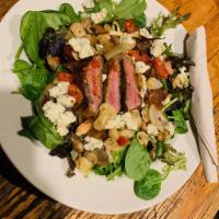 Black & Blue Steak Salad · Blackened seared Strip served on a bed of fresh baby spring mix with tomatoes, sauteed mushr...