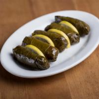 Stuffed Grape Leaves · Grape leaves delicately filled with rice and herbs.