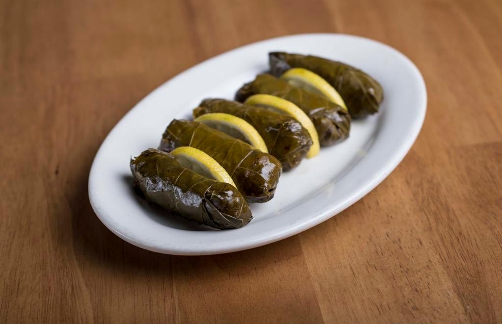 Stuffed Grape Leaves · Grape leaves delicately filled with rice and herbs.