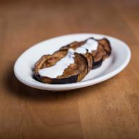 Pan Fried Eggplant · Sliced fried eggplant served with yogurt and garlic sauce. Served cold.
