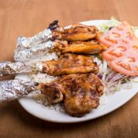 Chicken Chops · Marinated chicken thighs with bone grilled to your taste.